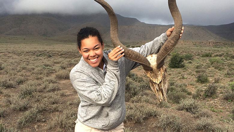 Erica Newton with the skull of a kudu in South Africa