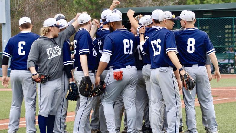 Penn State Mont Alto baseball players huddle on the field
